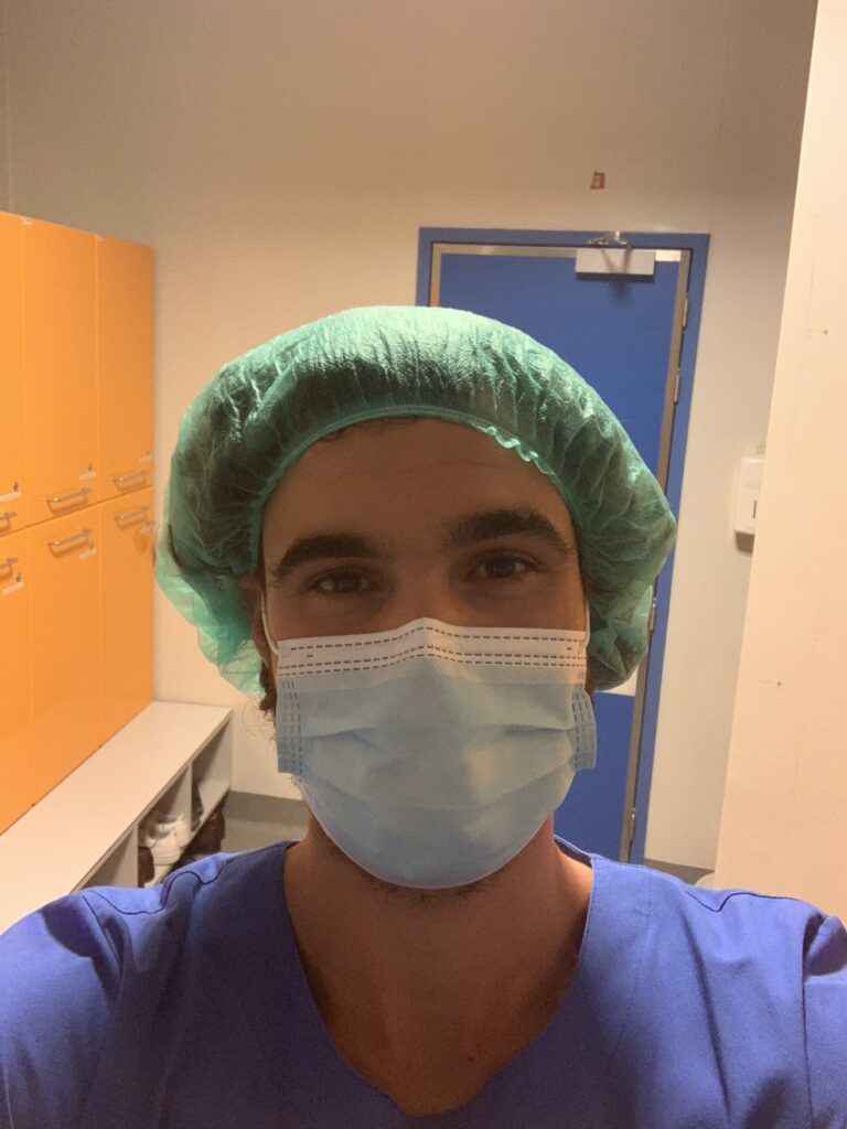 Befriend Your Emotions Dr. Filipe Rocha in scrubs, a surgical cap and a mask at the hospital